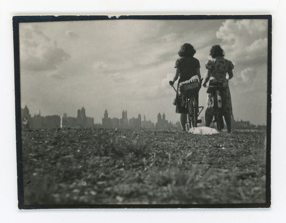 Two girls on hill overlooking Chicago, Bike Trip, 1939.